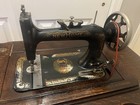     stunning  Antique New Home Treadle Sewing Machine   Wood Cabinet-tested Works