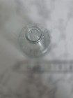 Clear Embossed Glass Decorative Bottle With Medallion Design  3 5 In Tall