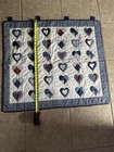 A Handmade Patchwork Quilt Featuring Heart Motifs