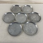 Set Of 7 Vintage Stamped Aluminum Coasters Fruit   Floral Embossed Metal