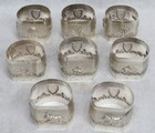 Set Of 8 Sterling Silver Figural High Relief Napkin Rings