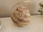 Vintage Hand-woven Lidded Basket Featuring A Coiled Design And A Braided Handle