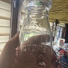 Vintage 5 Cent Universal Store Half Pint Embossed Glass Milk Bottle Wagon Wheel