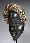 A Classic Old Dan Mask With Corie Shell Adornment