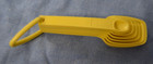 Vintage Tupperware Yellow Nesting Measuring Spoons Complete Set Of 7 With Ring