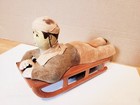 Nice Vintage  Wind Up  Tin Boy With Clothing On A Sled  Made In  Japan