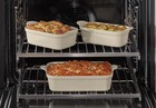 Our Place Five Piece Bakeware Set Steam With Oven Mat