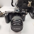 Canon Eos Rebel X 35mm Film Camera Lot  2 Lenses  Aux  Flash  Lens Filters