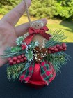 Gingerbread Man greenery Atop A Red Sliegh Bell 6x5 Christmas Ornament