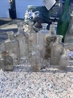 Lot Of 9 Vintage Clear Glass Assorted Bottles Medium Sizes