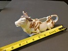 Antique Brown And White Sitting Bull Creamer