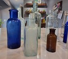 Lot Of 12 Antique Embossed Glass Medicine   Misc  Bottles Vtg
