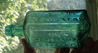 1860 From The Laboratory Of G w merchant Lockport Pretty Teal Medicine Bottle