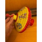 Vintage Curious George Tin Spinning Top Schylling Yellow Red Monkey Toy