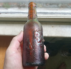 1929 Genuine Ginger Beer Emb Man Holding Glass Amber Bottle With Emb Indian Base