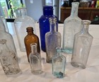 Lot Of 12 Antique Embossed Glass Medicine   Misc  Bottles Vtg