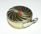 Vintage German Measuring Tape 1920 s Era Gold Metal Round Button Retractable