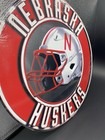 Nebraska Cornhuskers Football Helmet Decorative Plaque  Metal 11 3 4    Diameter