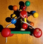 Kouvalias Vintage Child s Green Wooden Pull Toy With Bell And Red Balls