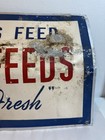 Vintage Circle Feeds Thousands Feed Metal Sign