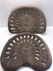 2 Vintage Stamped Steel Tractor Seats