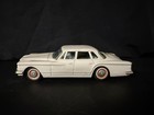 Early 60   s Japanese Tin Friction 4-door Chrysler Valiant Toy Car