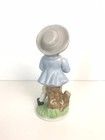 Porcelain Figurine Vintage Hand Painted Colonial Boy Holding Yellow Bird   Cage