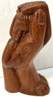 Vintage Hand Carved Wooden Child Figurine In Warm Embrace Of Comforting Hand