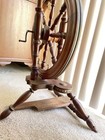 Vintage Upright Wooden Spinning Wheel With Ornate Details And Treadle