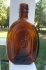 Antique E b    Co  Oval Shaped Orange-amber Liquor Bottle