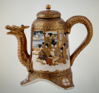 A Japanese Satsuma Dragon Lidded Tea Pot With The Shimazu Clan Crest On Bottom