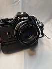 Vintage Nikon Em 35mm Slr Film Camera W bundle Nikon 2 Lenses  Flash  Power Wind