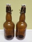 2 Vintage Grolsch Beer Bottles Glass Embossed Amber Brown Porcelain Swing Top 