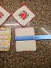 Potholders Hand Crocheted  2 With Raised Rosettes Yellow Pink Vintage