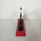 Cast Iron Vtg Nutcracker Sitting On A Bright Red Wooden Base Vibrant Colors