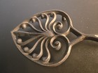 Vintage Cast Iron Footed Spear Shape Floral Pattern Trivet 10   Long