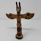 Wood-carved Totem Pole-bear And Raven Figure Symbolizing Strength And Creation 