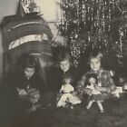 Vintage Snapshot Photo Holding Dolls Christmas Tree Tinsel Xmas Photograph