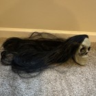 Skull With Black Long Hair Wig Glued To The Top Halloween Prop