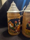 Set Of 4 German Style Lidded Beer Steins Raised Relief Breweriana Theme
