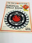 Original New Old Stock World s Fair Car Grille   Scooter Badge 1982 Htf