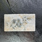 A Decorative Repouss   Metal Hairpin Box With Floral Motifs And Inscription 