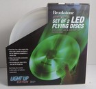 Frisbees  Set Of 2 Led Flying Discs  1 Red And 1 Green  Brookstone New