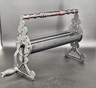Antique vintage Cast Iron Newspaper Log Roller Fireplace Tool Wood Handle