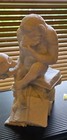 Monkey Holding A Skull Figurine