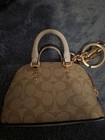 Coach Beige Leather Key Chain Charm With Logo Print And Gold Hardware