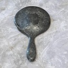Silver Plated Hand Held Mirror With Intricate Raised Floral Scrollwork