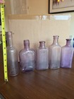 Vintage Amethyst Purple Glass Bottles Lot Of 4 Embossed Half Pint 8 Oz Lyric