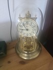 Koma Anniversary torsion Clock Gold Tone Glass Dome Rotating Pendulum Arabic