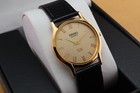 Vintage Seiko Slim Round Quartz Men s Wrist Watch Gold Dial With Black Strap 